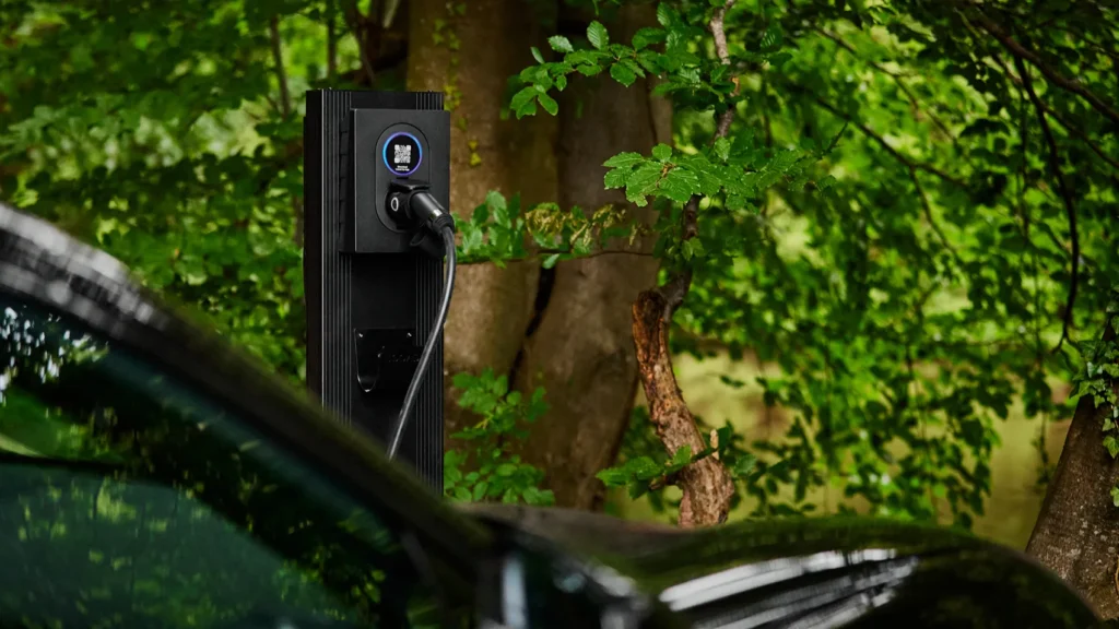 a black rechargeable power supply plugged into a car